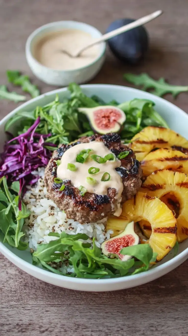 A colorful Pineapple Burger Bowl with Sweet Fig Mayonnaise, featuring a beef patty, grilled pineapple, and fresh greens.